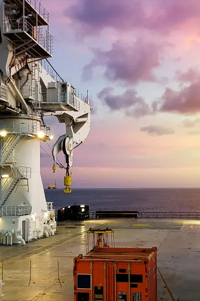 Offshore vessel with pink skies in the background