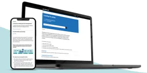 Laptop and phone displaying the Leading for Safety publication