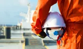 Seafarer holding a helmet