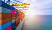 Cargo ship carrying container box with quay crane