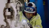 Maritime and Coastguard Agency surveyor inspecting machinery on ship